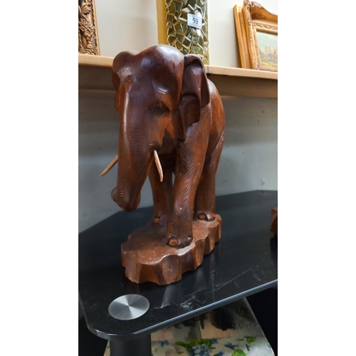 60 - 2 lovely vintage teak carvings of a bull and cow elephant height 31cm and 38cm COLLECT ONLY