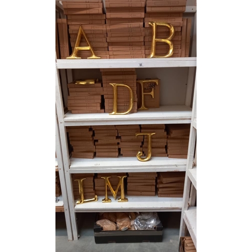 83 - A quantity of gold coloured letters etc