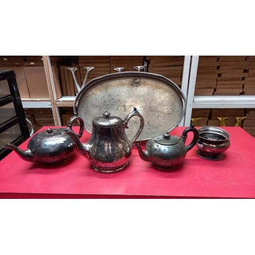 87 - A silver plated tray, pewter teapots etc