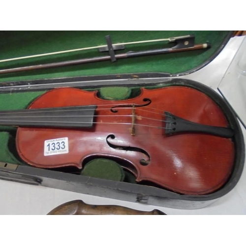 1333 - An old cased violin with bow.