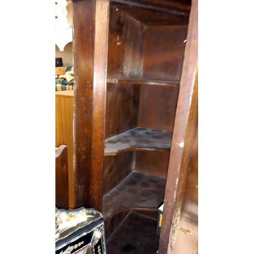 136 - A 19c oak corner cupboard with inlaid door and dentil cornice COLLECT ONLY