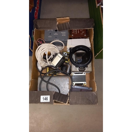 146 - A box of transformers, electric motors and electric clock cases, movements etc COLLECT ONLY