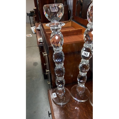 162 - 3 tall heavy glass candlesticks height 58.5cm to 78.5cm COLLECT ONLY