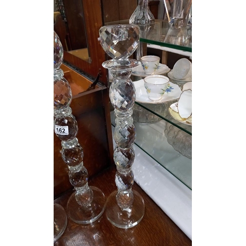 162 - 3 tall heavy glass candlesticks height 58.5cm to 78.5cm COLLECT ONLY