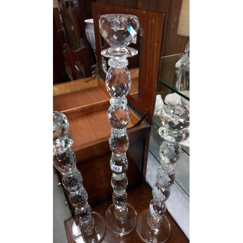 162 - 3 tall heavy glass candlesticks height 58.5cm to 78.5cm COLLECT ONLY