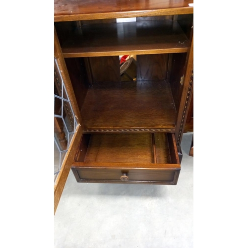 173 - A dark oak display cabinet with leaded glass door, COLLECT ONLY