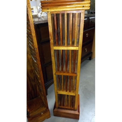 174 - 2 solid teak cd stands, 1 with wrought iron door panel 21cm x 21cm x height 87cm and 20cm x 18cm x h... 