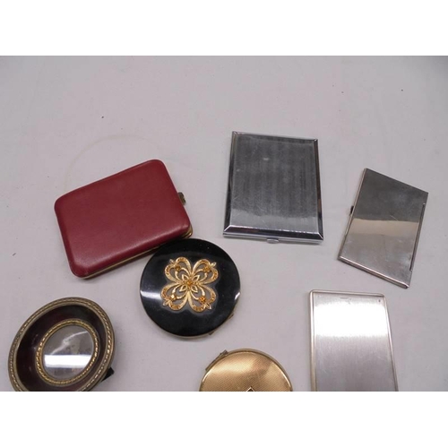 1166 - A mixed lot including compacts, cigarette cases etc.,