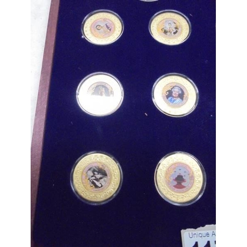 1173 - A cased set of twelve Historic Moments of Queen Elizabeth II reign and one other coin.