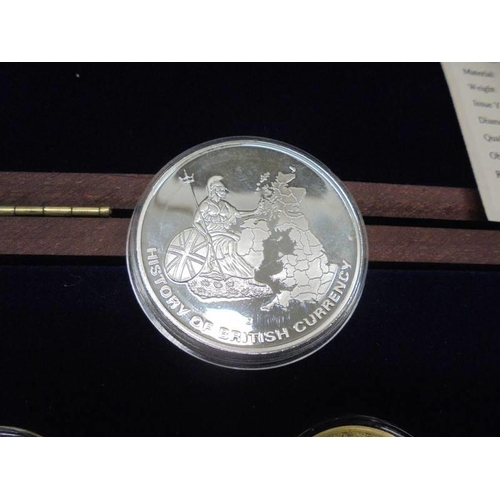 1173 - A cased set of twelve Historic Moments of Queen Elizabeth II reign and one other coin.