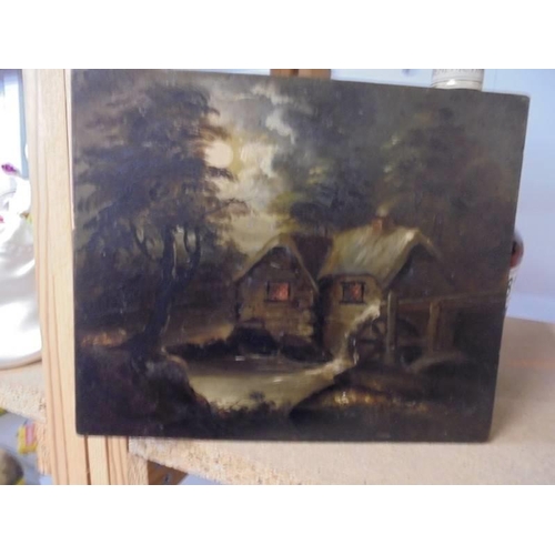 1177 - A small oil on board cottage scene.