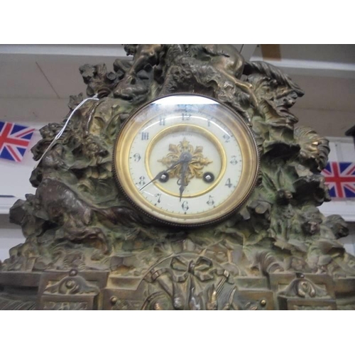 1188 - A heavy metal clock surmounted horse and rider. COLLECT ONLY.