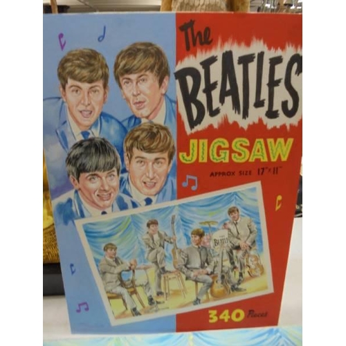 1205 - Two paintings of the Beatles by Walt Howarth.