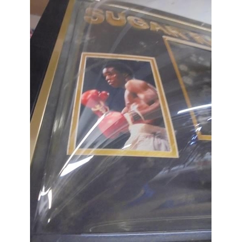 1208 - A framed and glazed Sugar Ray Leonard collage including boxing glove. COLLECT ONLY.