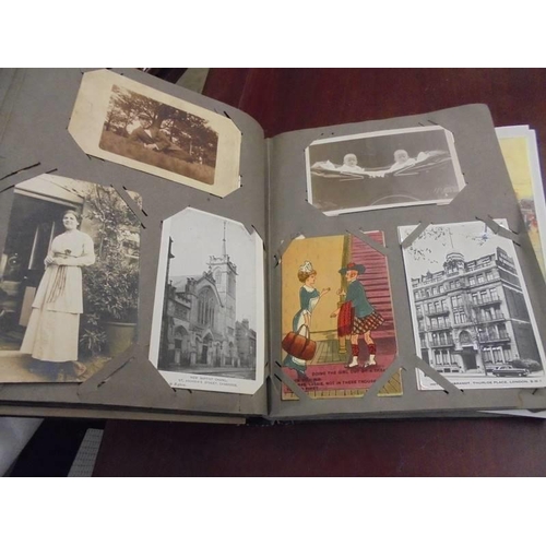 1376 - A good Edwardian photo album with postcards.