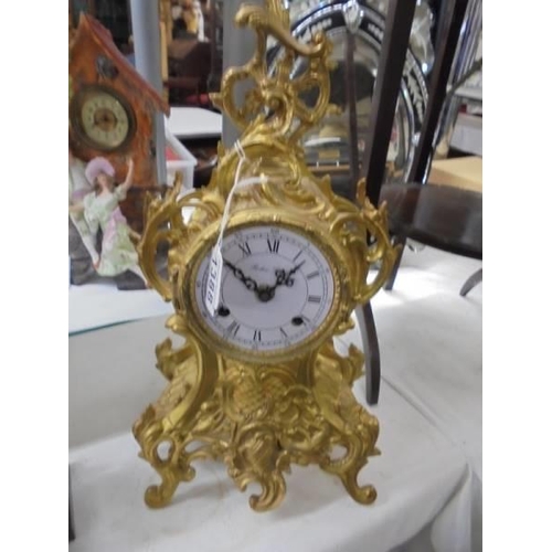 1388 - An ornate French mantel clock, a/f missing glass.