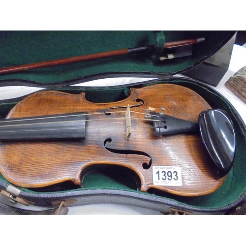 1393 - An old violin and bow in case.