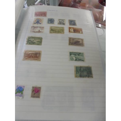 1403 - Two albums of world stamps.