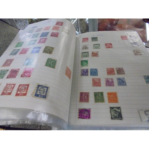 1403 - Two albums of world stamps.