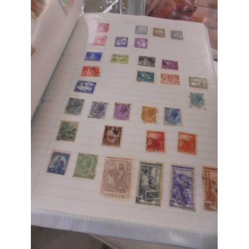 1403 - Two albums of world stamps.