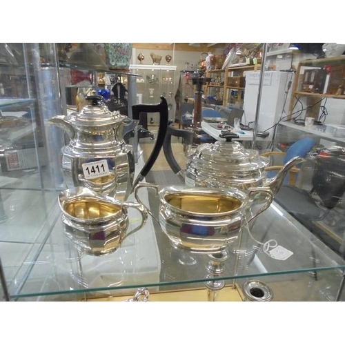 1411 - A four piece silver plate tea set.