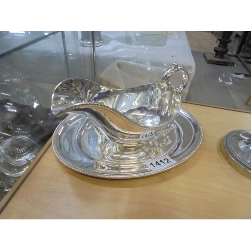 1412 - A silver plate gravy boat on tray.