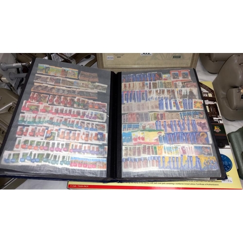 211 - 5 albums of stamps