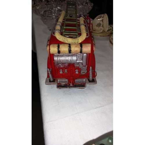 215 - A large pressed steel and fibre glass model of a vintage American fire engine length 36cm