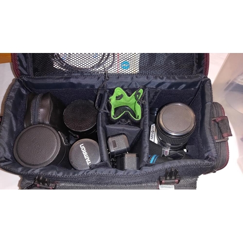 227 - A Minolta X-9 35mm and Minolta X-300 cameras with lenses carry case and tripod