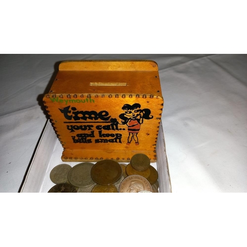 230A - A vintage wooden Weymouth money box and quantity of coins including 1921 half crown etc.