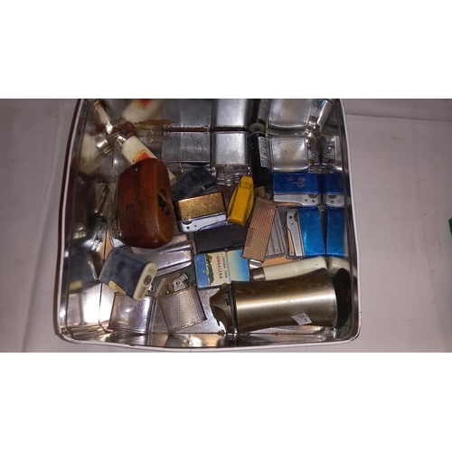 234 - A box of old lighters