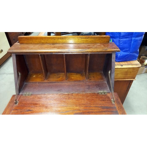 265 - A 1930/50's oak bureau bookcase, including books  66cm x 23cm x height 97cm COLLECT ONLY