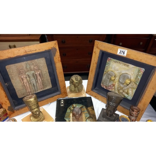 276 - A quantity of Egyptian revival ornaments including framed plaques