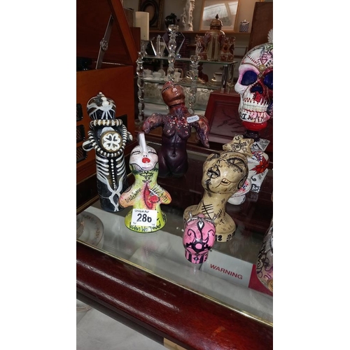 286 - 2 skull ornaments and other figures including picture by artist Joanna Weir COLLECT ONLY