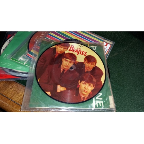 297 - A quantity of The Beatles singles