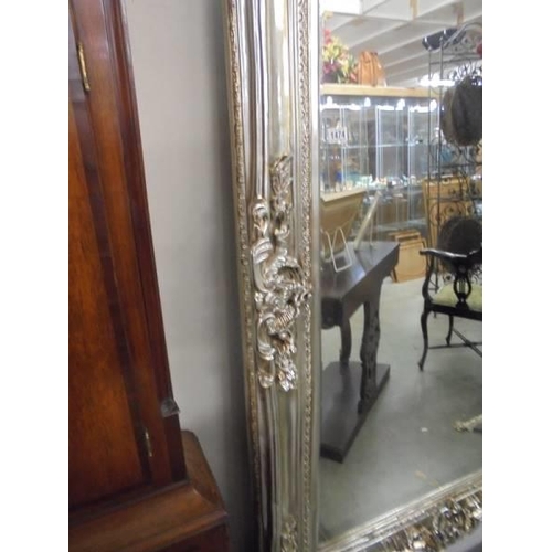 1474 - A large decorative mirror in silver coloured frame. COLLECT ONLY.