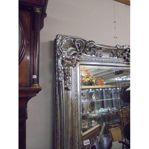 1474 - A large decorative mirror in silver coloured frame. COLLECT ONLY.