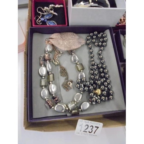 1237 - A mixed lot of good quality costume jewellery including stands