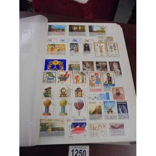 1250 - Two albums of postage stamps.