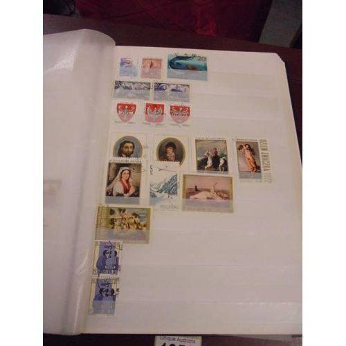 1250 - Two albums of postage stamps.