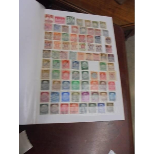 1250 - Two albums of postage stamps.