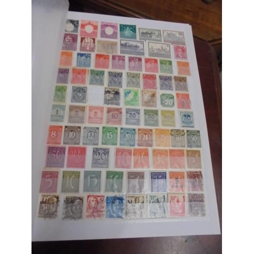 1250 - Two albums of postage stamps.