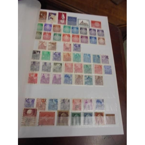 1250 - Two albums of postage stamps.