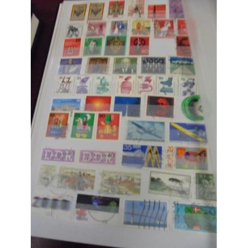 1250 - Two albums of postage stamps.