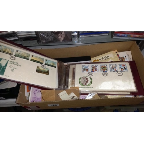 320 - A quantity of first day covers, stamps & first day issue postcards