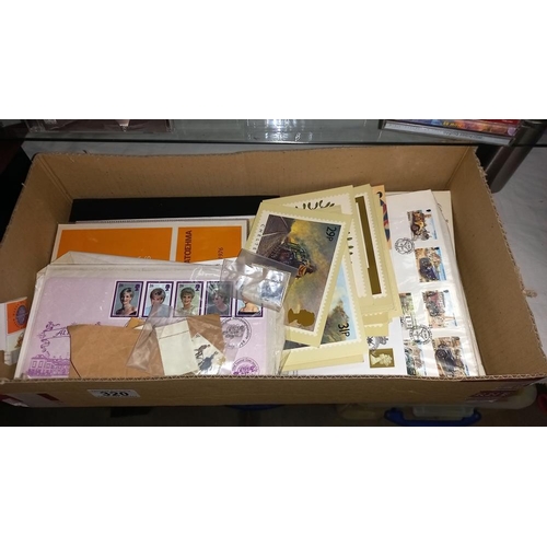 320 - A quantity of first day covers, stamps & first day issue postcards