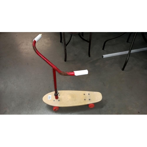 323 - A vintage 1970's skateboard with scooter handlebars, COLLECT ONLY