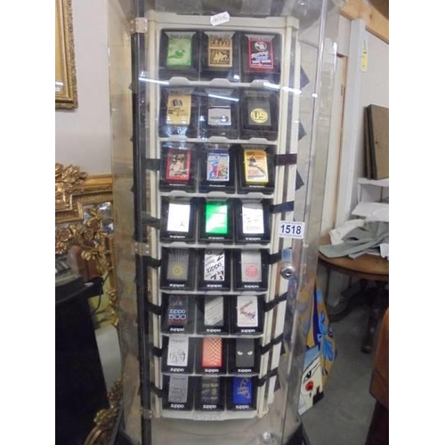 1518 - A Zippo lighters collector's cabinet complete with 100 lighters and magazines. (should revolve but n... 