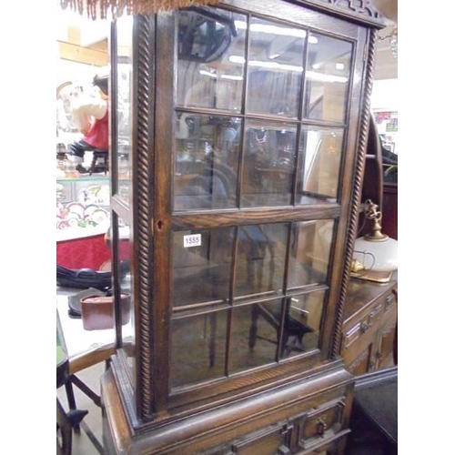 1555 - An oak glazed cabinet on stand COLLECT ONLY.