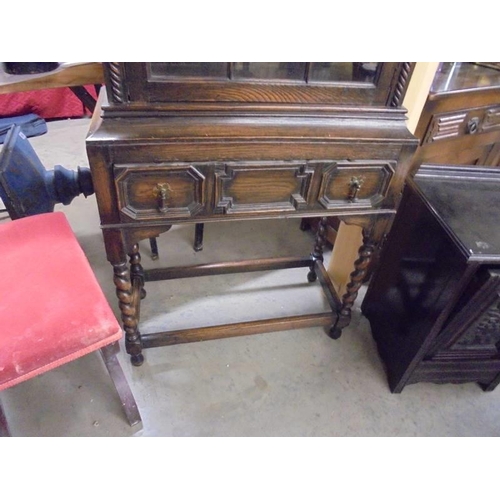 1555 - An oak glazed cabinet on stand COLLECT ONLY.